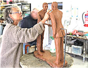 Laury creating the clay sculpture